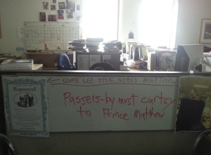 Whiteboard and desk showing promotions for Rapunzel play